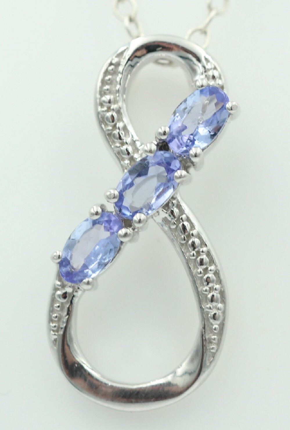 0,72 Carat Tansanit Anhänger Unendlichkeit 925 Silber  Infinity Tansanit aus Afrika