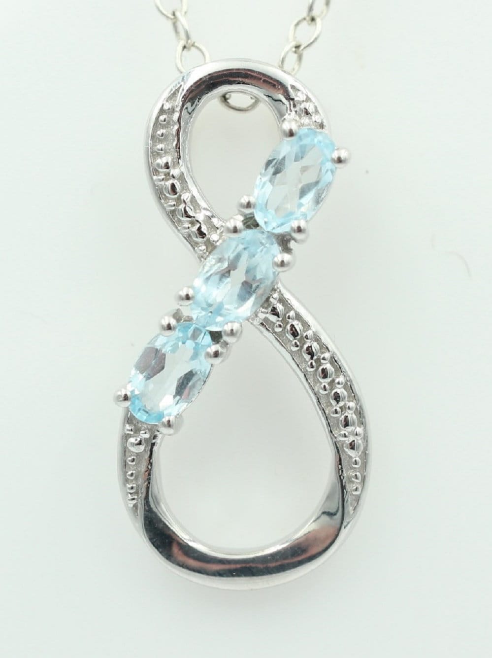 0,72 Carat Blautopas Anhänger Unendlichkeit 925 Silber Infinity