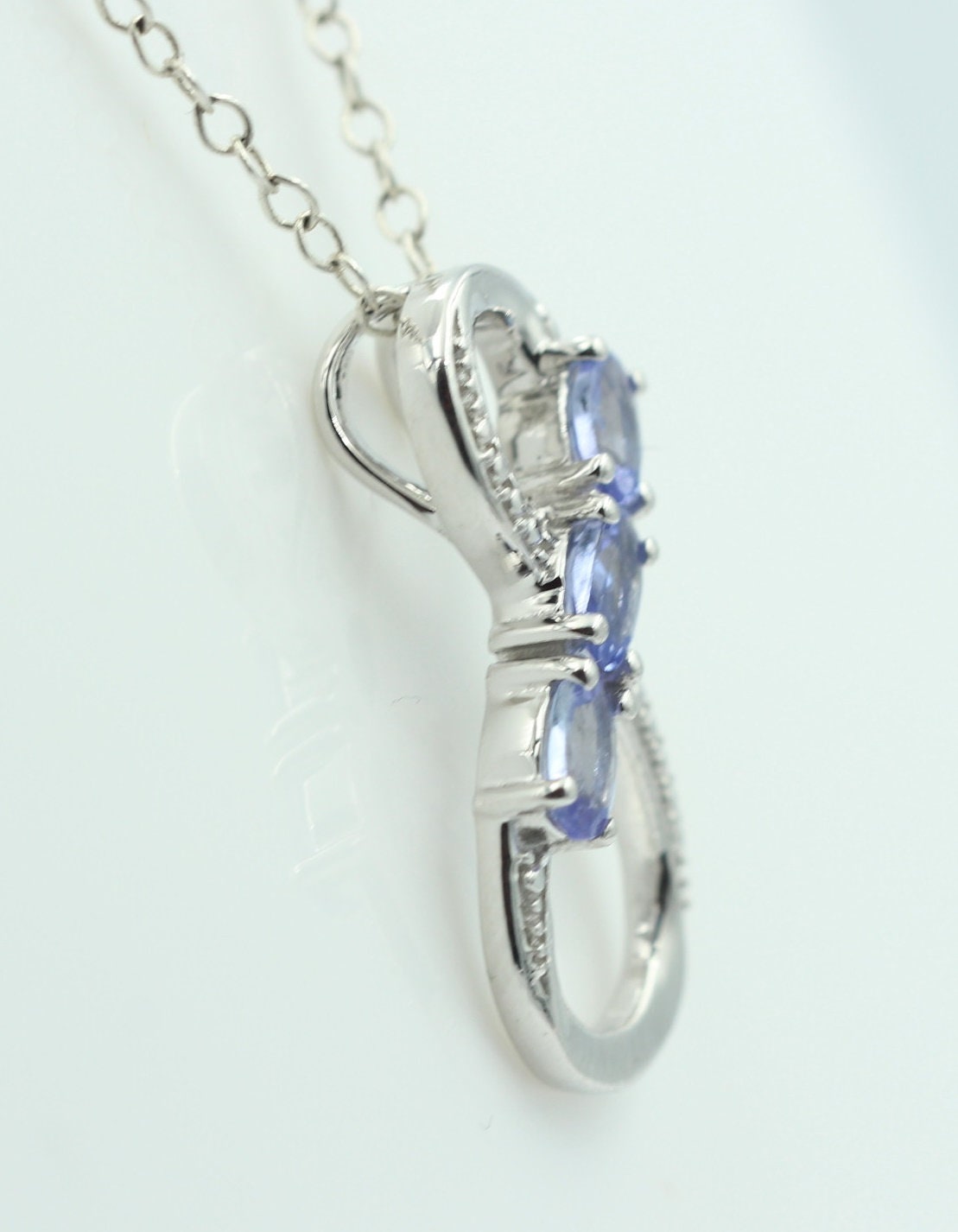 0,72 Carat Tansanit Anhänger Unendlichkeit 925 Silber  Infinity Tansanit aus Afrika