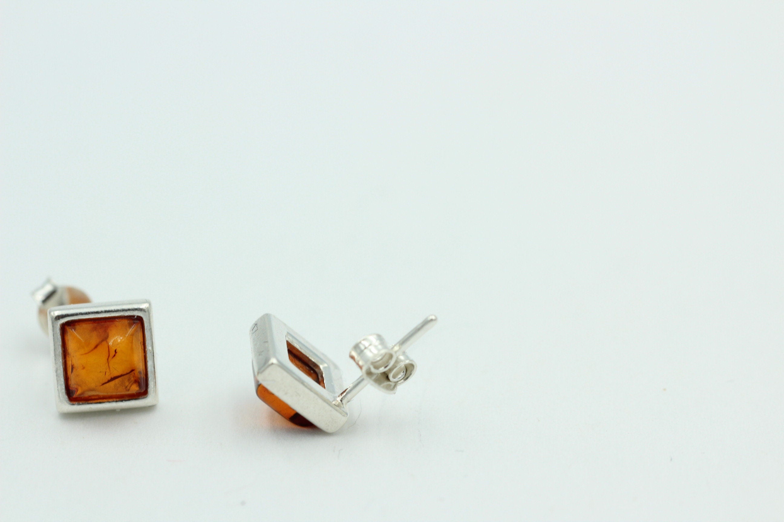 Bernstein Ohrstecker 7 x 7 mm aus 925 Sterlingsilber brauner Bernstein Unisex