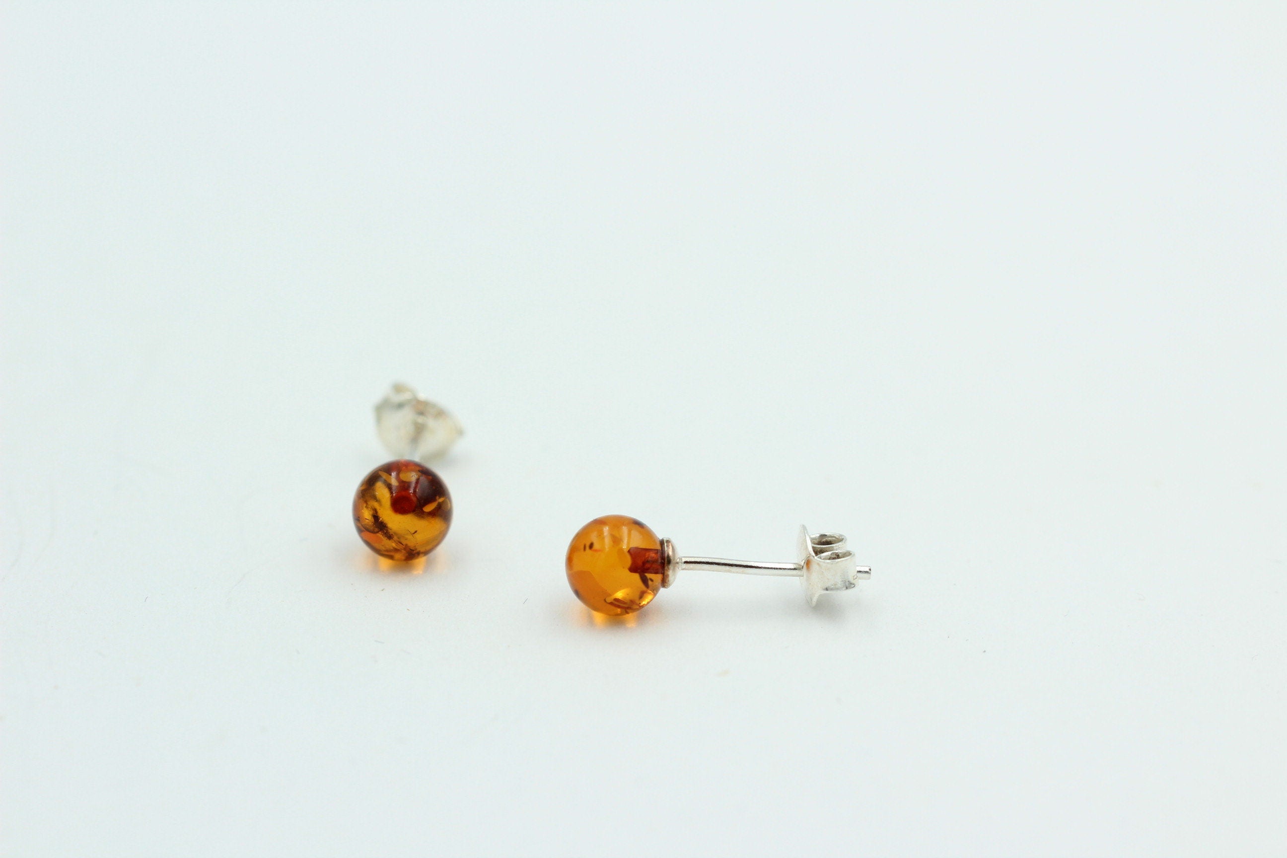 Bernstein Ohrstecker goldbraun 925 Silber Kugelohrstecker Unisex